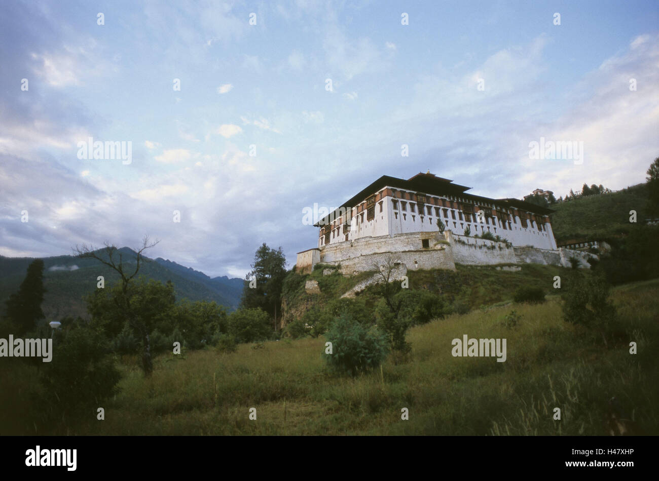 Bhutan, Paro, cloister fortress Dzong, scenery, dusk, Asia, the Himalayas, kingdom, Westbhutan, cloister, cloister plant, cloister castle, fortress, structure, building, historically, architecture, culture, religion, faith, Buddhism, place of interest, mountains, wood, nobody, outside, cloudy sky, Stock Photo
