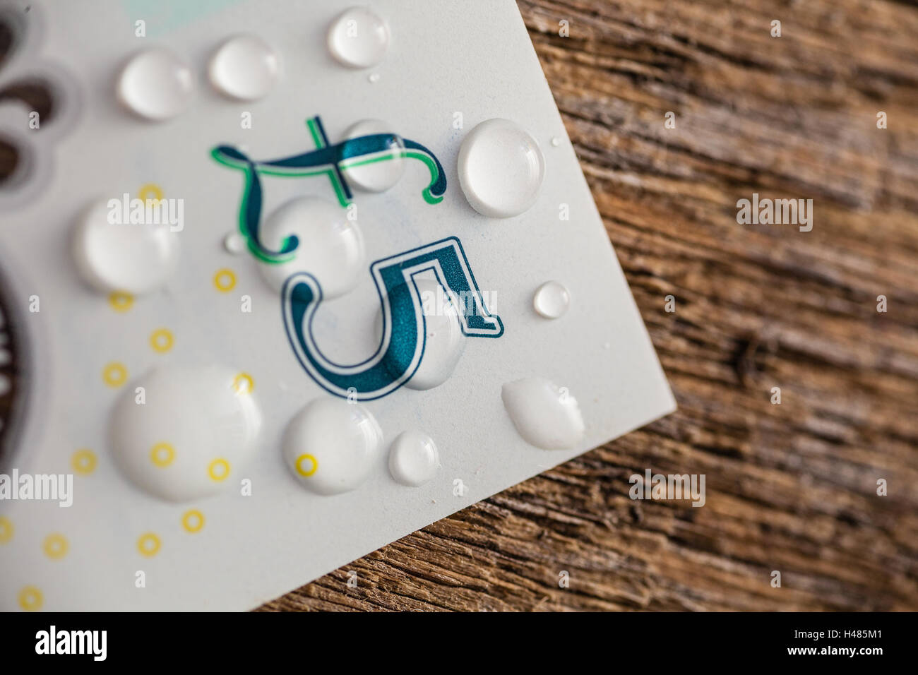 New United Kingdom five pound note. Water droplets showing its plastic ...