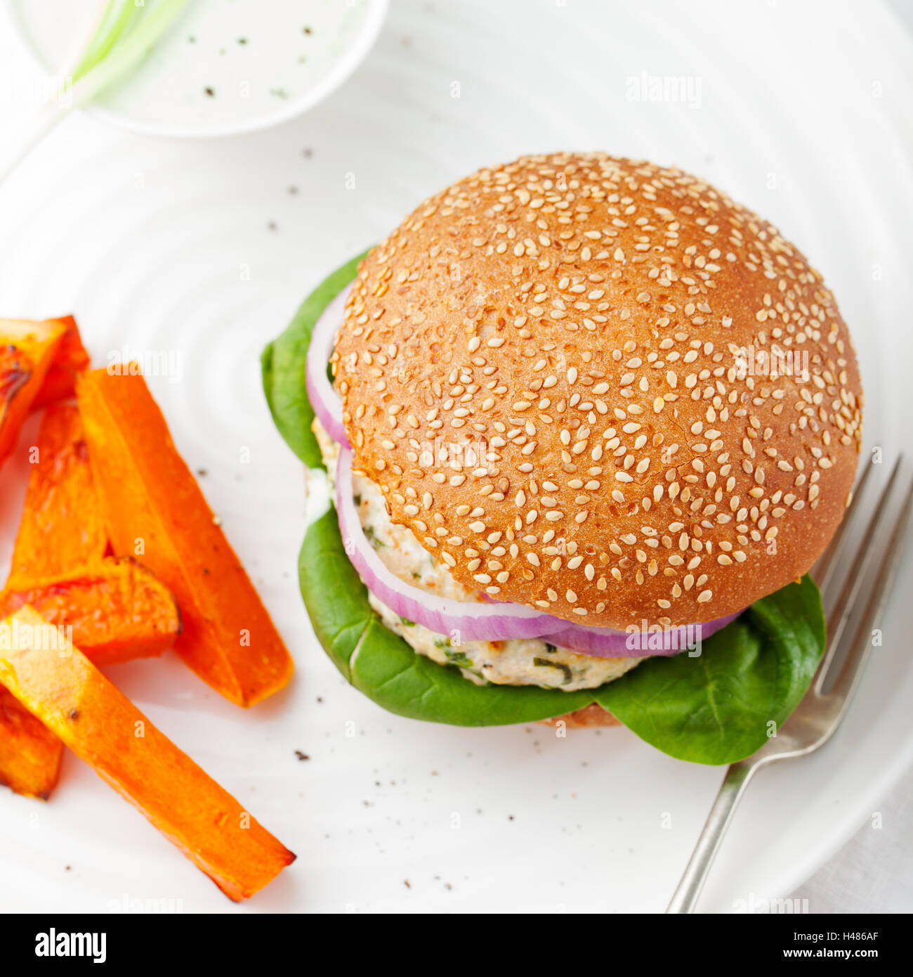 Burger with turkey, spinach, roasted potato, batat Stock Photo