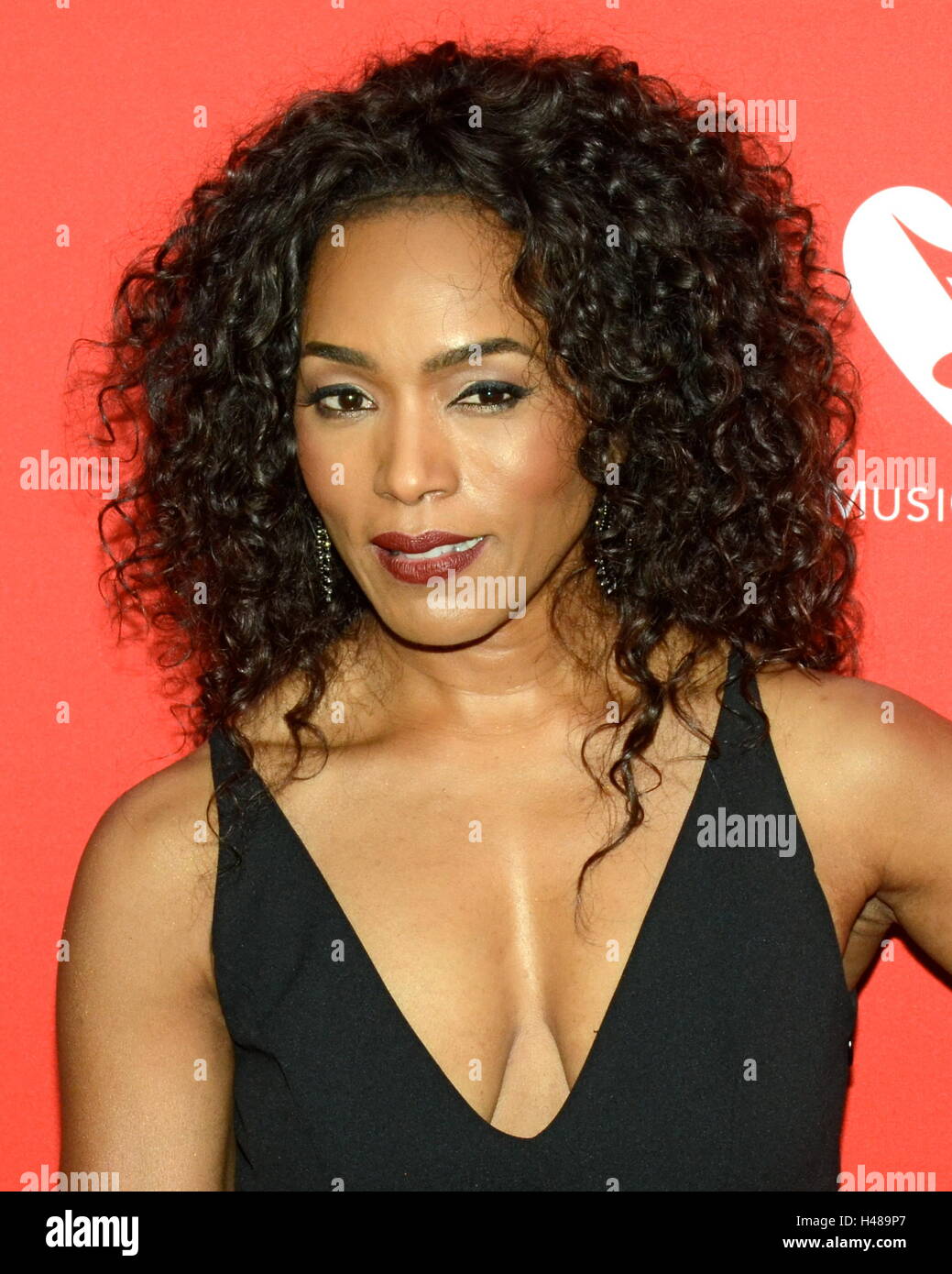 Angela Bassett arrives for the 12th Annual MusiCares MAP Fund Tribute Concert at The Novo by Microsoft on May 19, 2016 in Los Angeles, California. Stock Photo