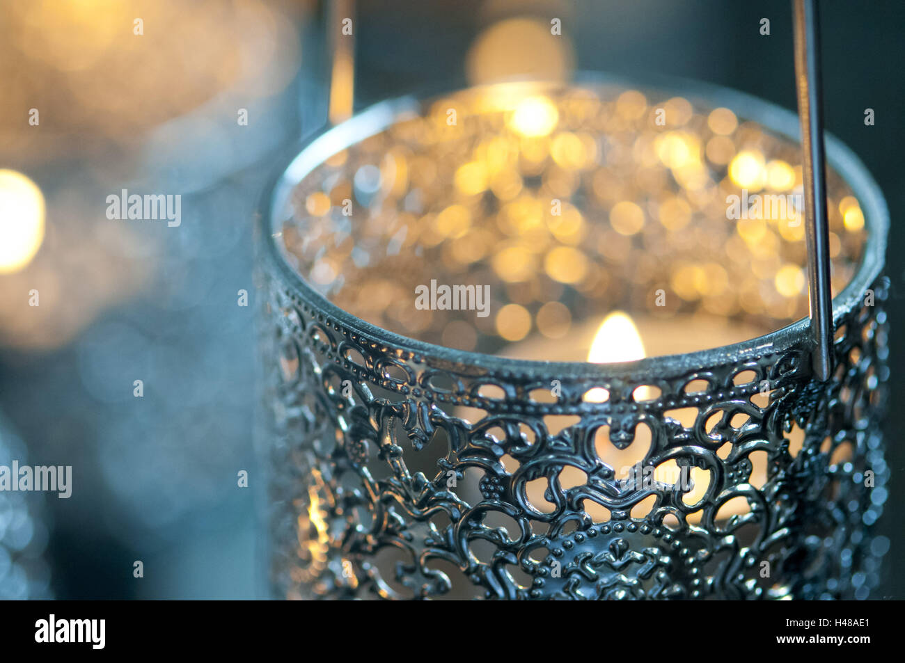 Candle in metal vessel Stock Photo Alamy