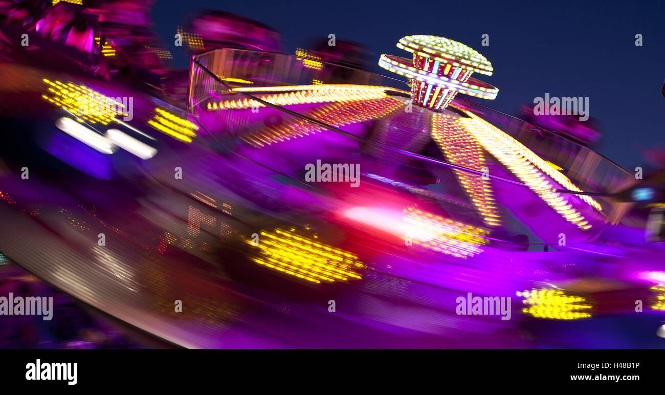 amusement ride at the Oktoberfest in Munich by night, Stock Photo