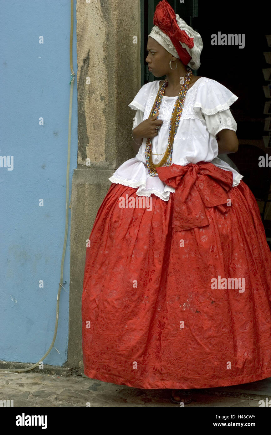 Brazil, Salvador de Bahia, Praca Anchieta, woman, dress, typically, no model release, South America, Latin America, person, stand, whole body, clothes, traditionally, typically for country, Baiana, headdress, rock, far, red, locals, necklaces, seriously, entrance, Stock Photo