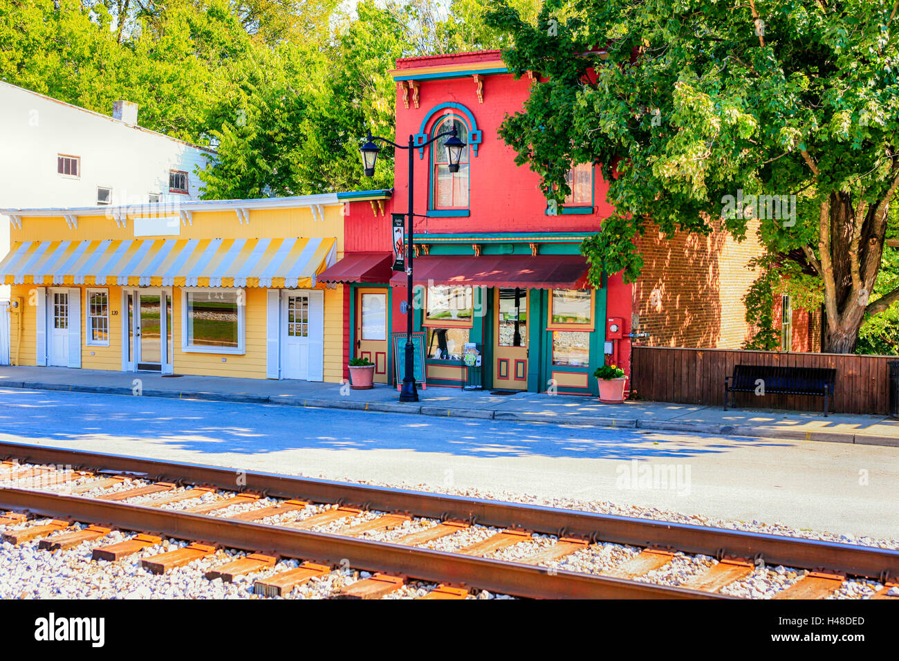 Main Street storefronts in downtown Midway, with the railroad track