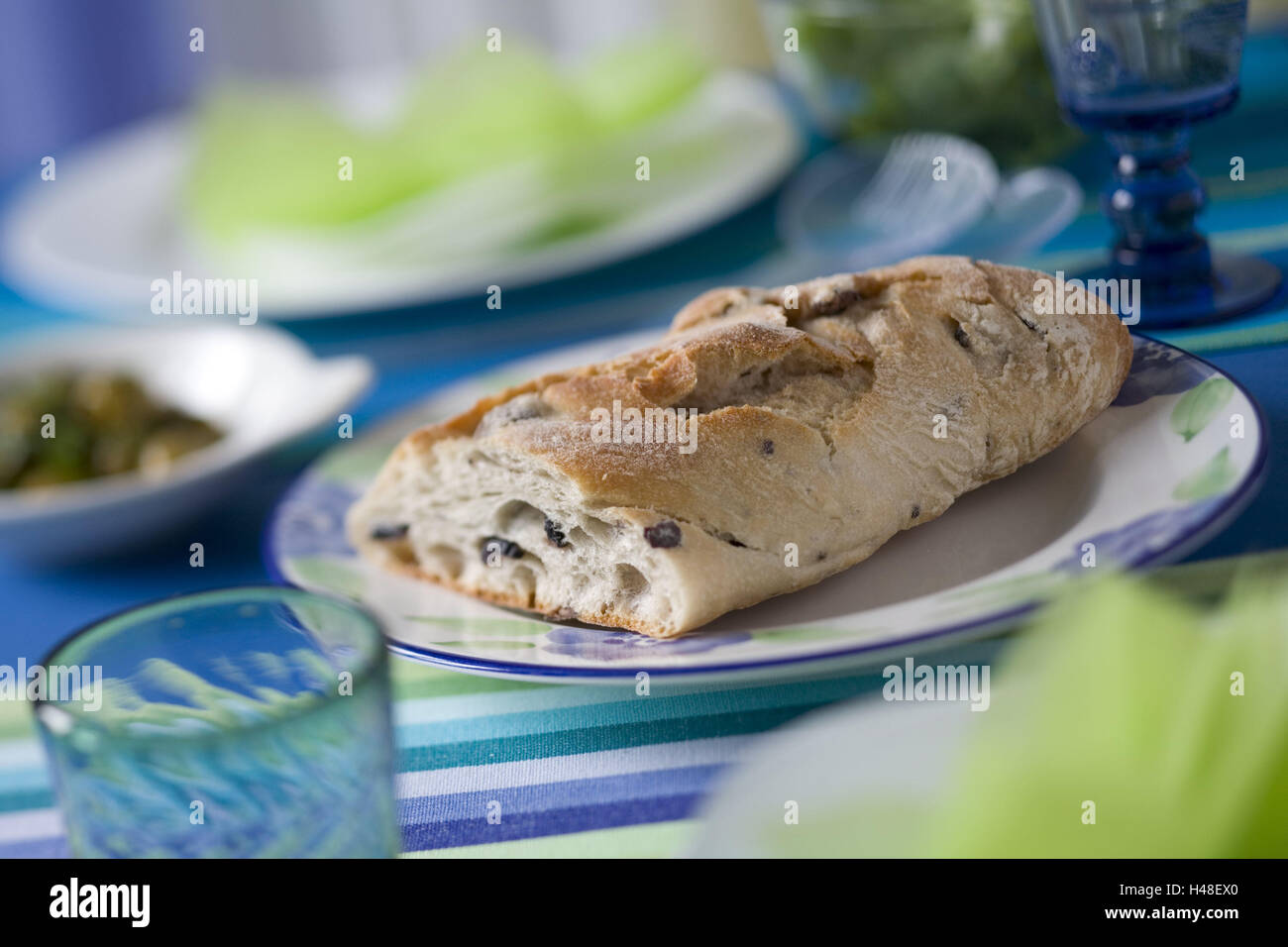 Table, covered, olive bread, Stilllife, Food, bread, white bread, plate, glass, napkins, table sets, green olives, salad server, salad, studio, Stock Photo