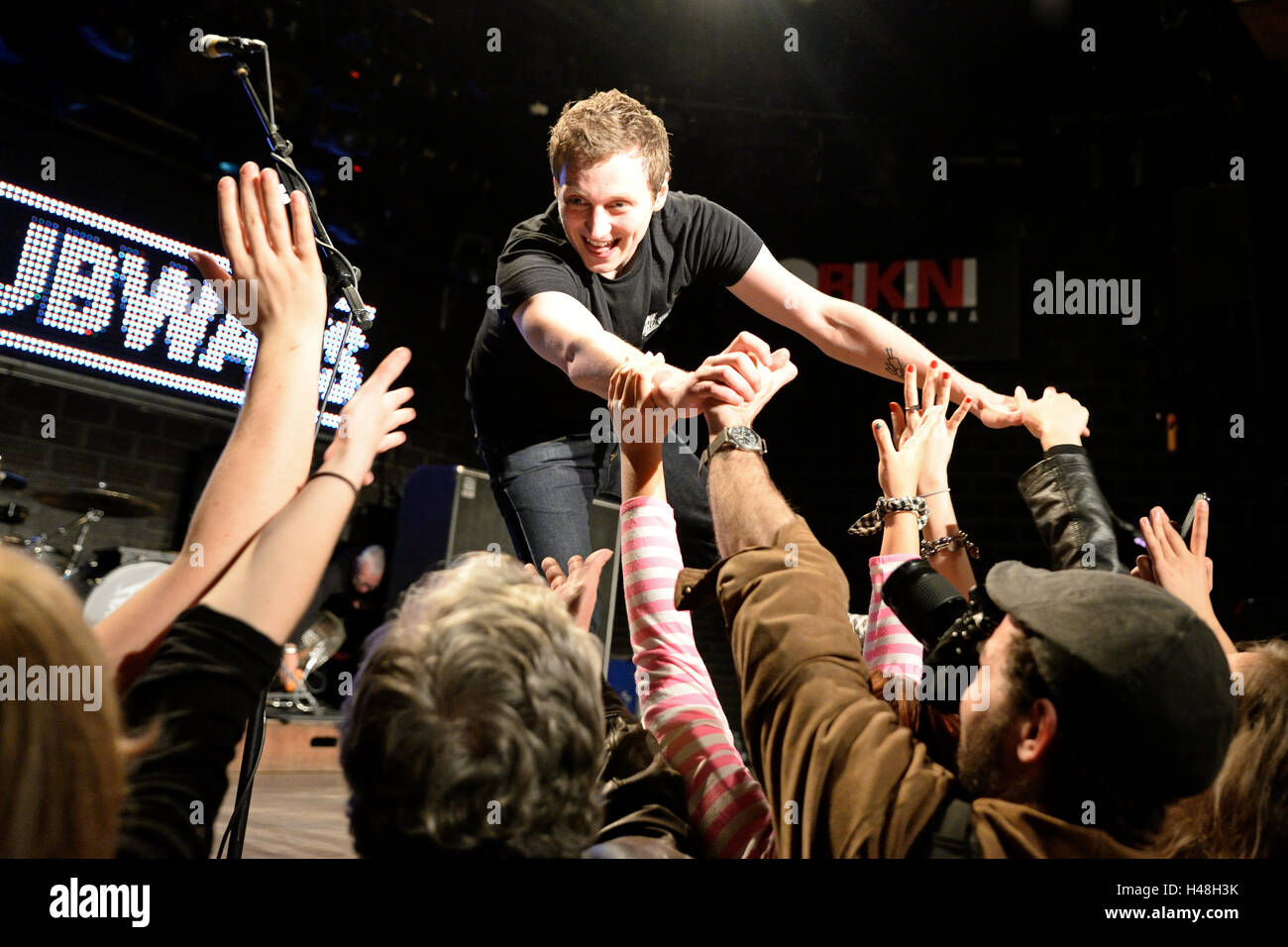 BARCELONA - MAR 18: The frontman of The Subways (rock band) performs with the crowd at Bikini stage. Stock Photo