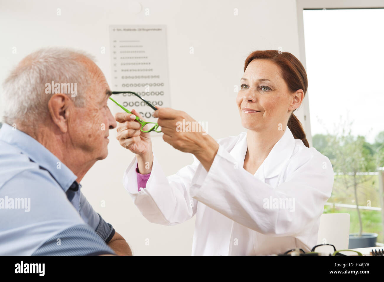 Boss will consult from his ophthalmologist, Stock Photo