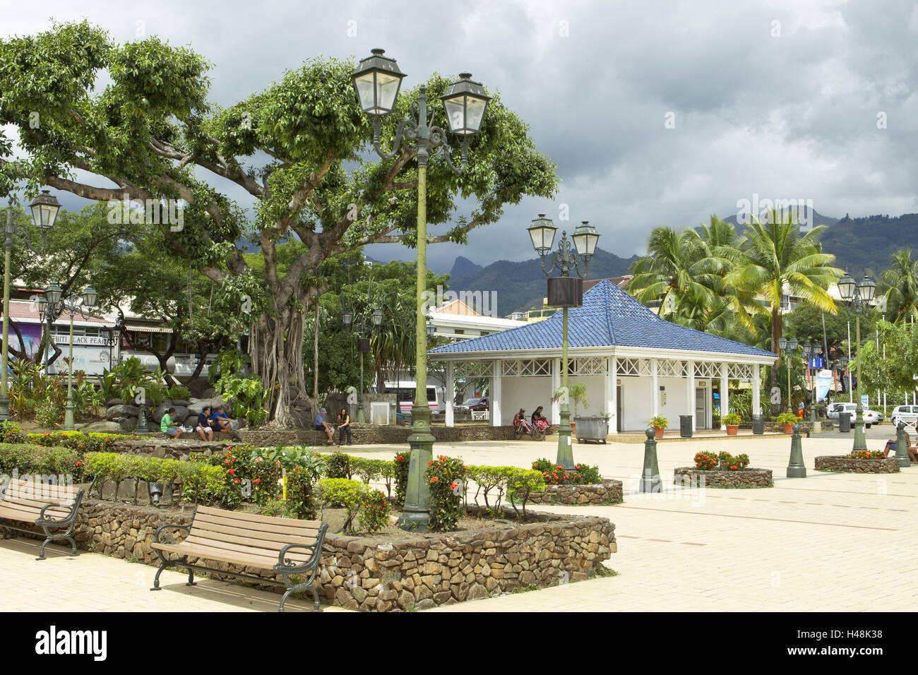 French Polynesia, Papeete, park, the Society Islands, Tahiti, space, park-bench, locals, people, tourists, buildings, palms, trees, lanterns, heavens, cloudies, saddles, Stock Photo