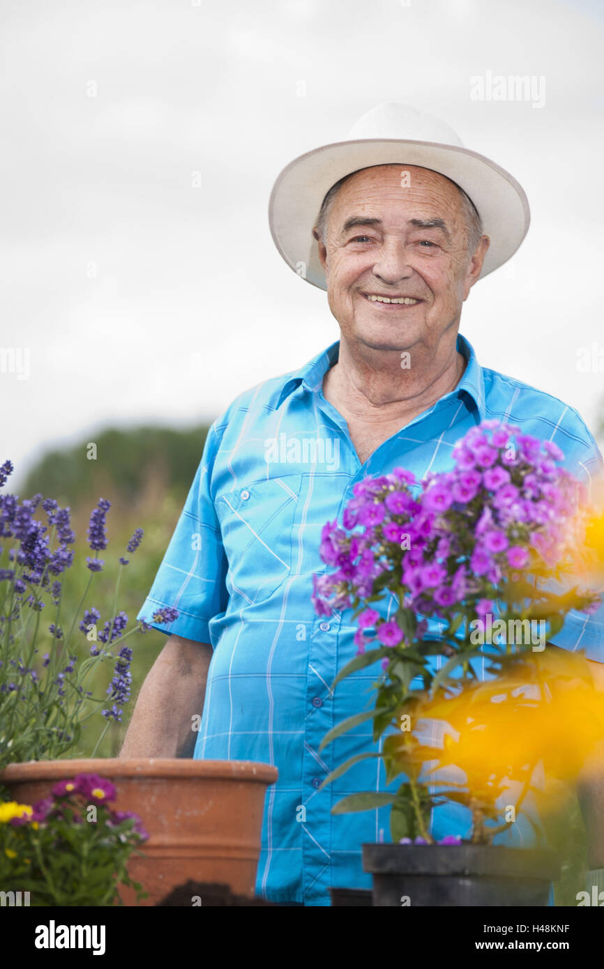 Older man working in the garden Stock Photo - Alamy