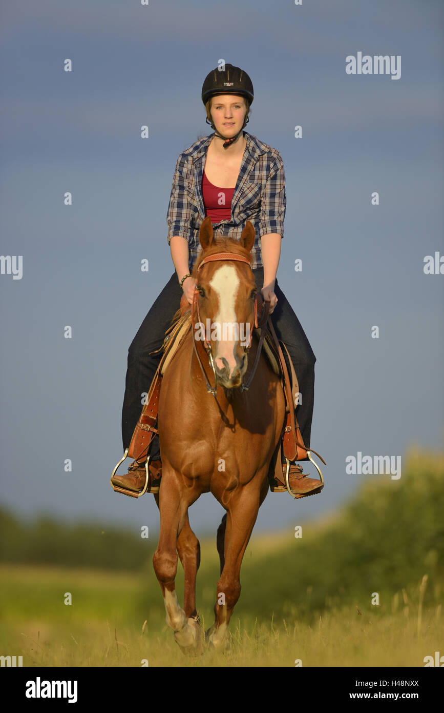 Teenage girl, horse, Paint Horse, back, sit, view camera, Stock Photo