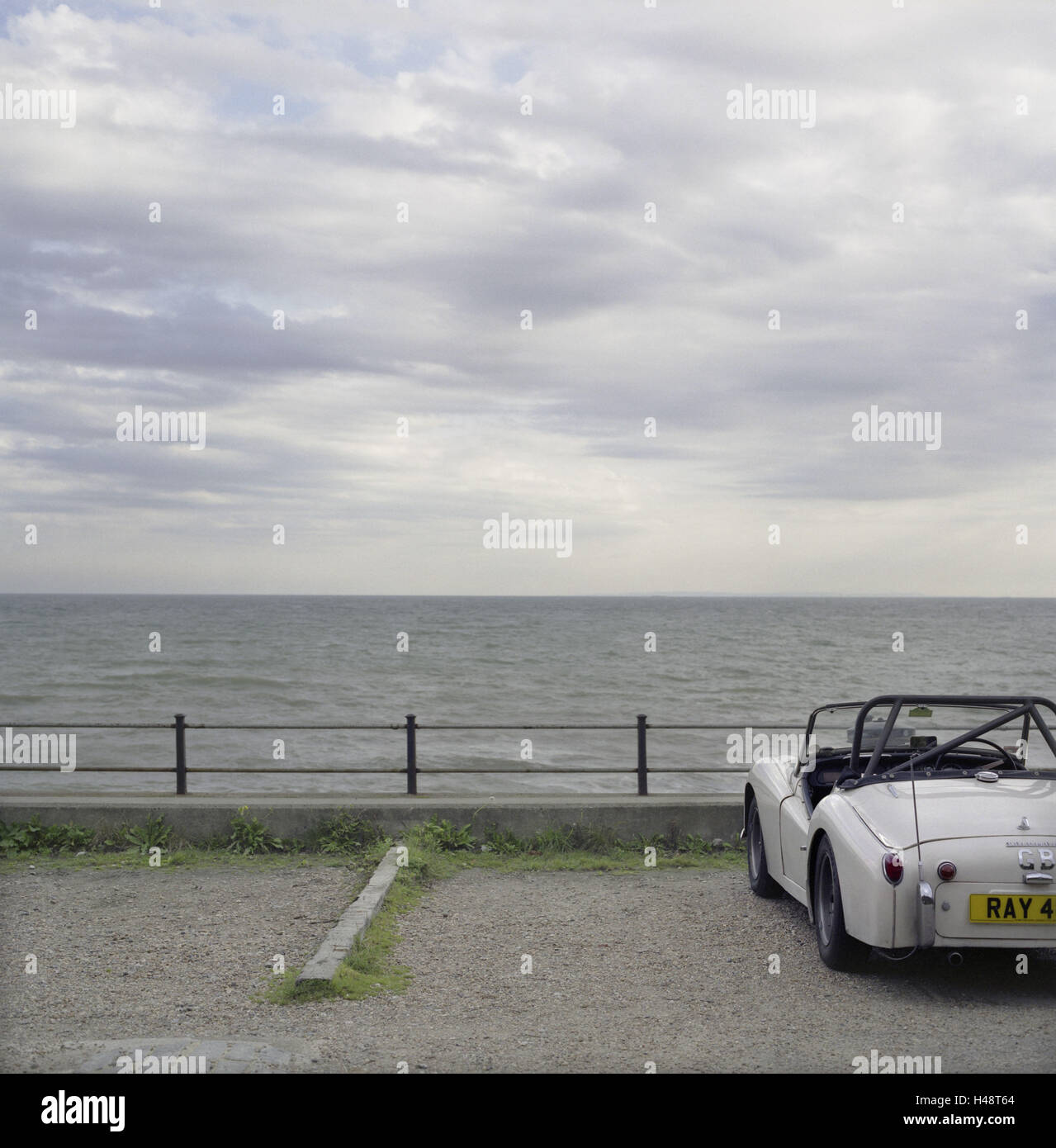 Car, vintage car 'Triumph' at English coast, Stock Photo