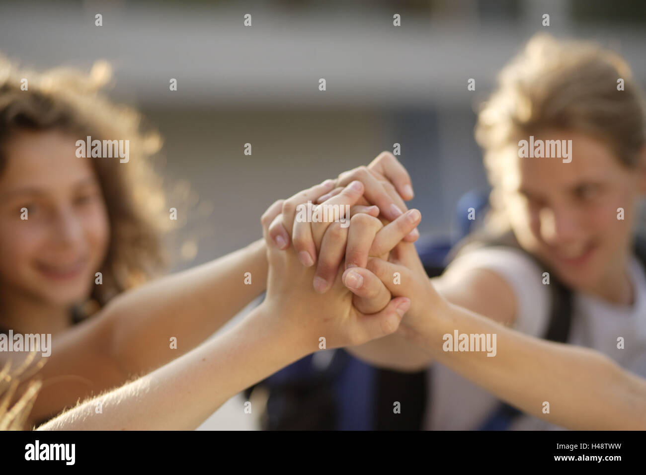 Girls, friends, hands, icon, friendship, cohesion, medium close-up, detail, Stock Photo