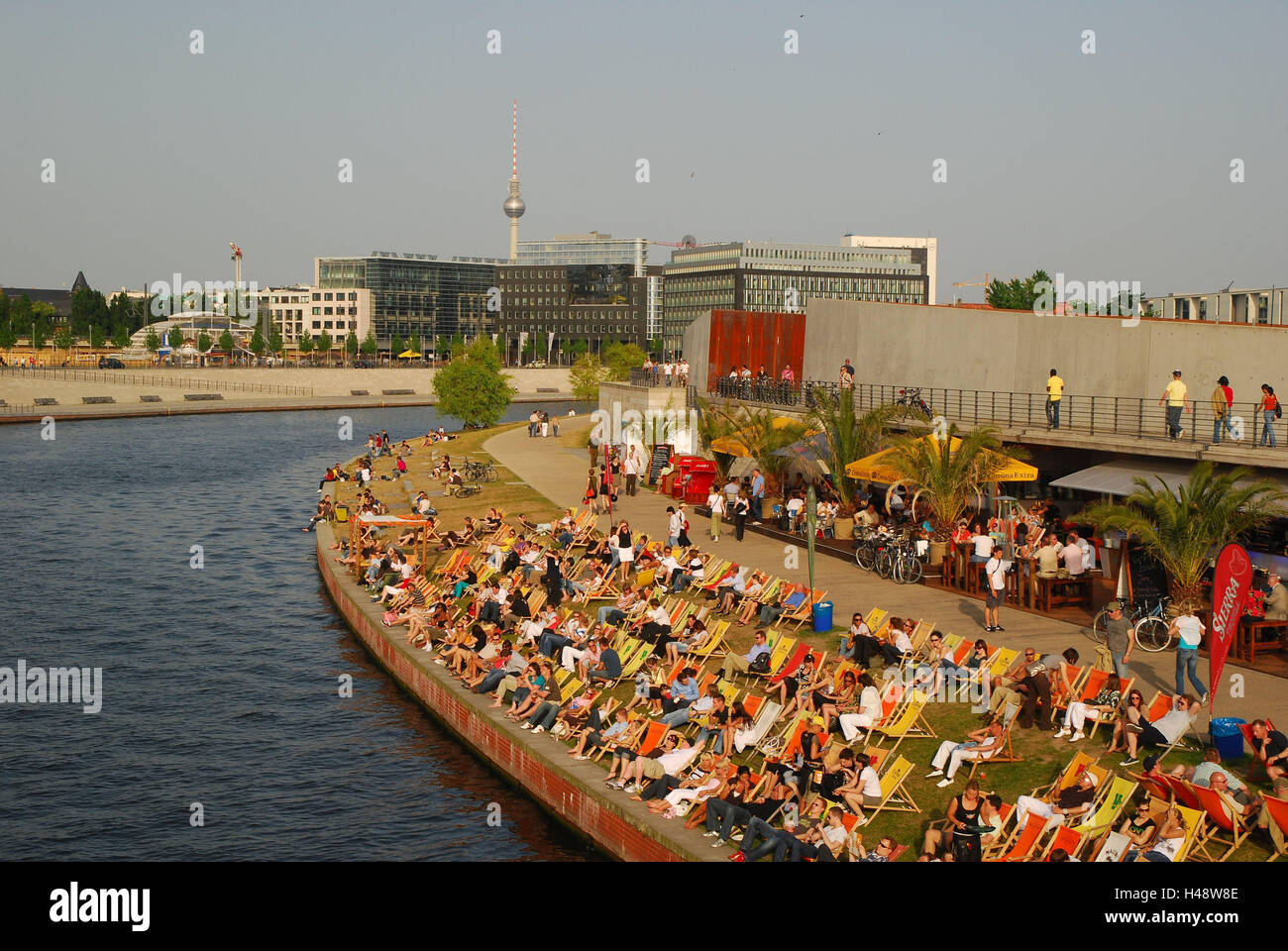 Germany, Berlin, Spree bow, beach cafe, deck chairs, people, town, capital, the Spree, river, riverside, summer, solar bath, guests, tourists, sun benches, take it easy, recreation, rest, leisure time, Stock Photo