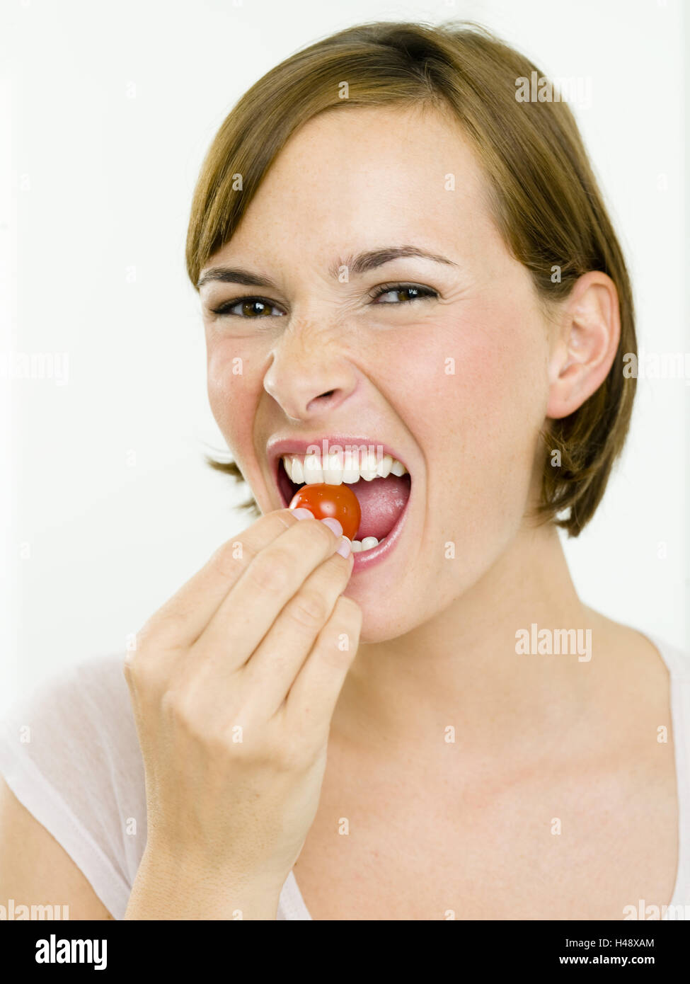 Woman, young, paprika, bite off Stock Photo Alamy