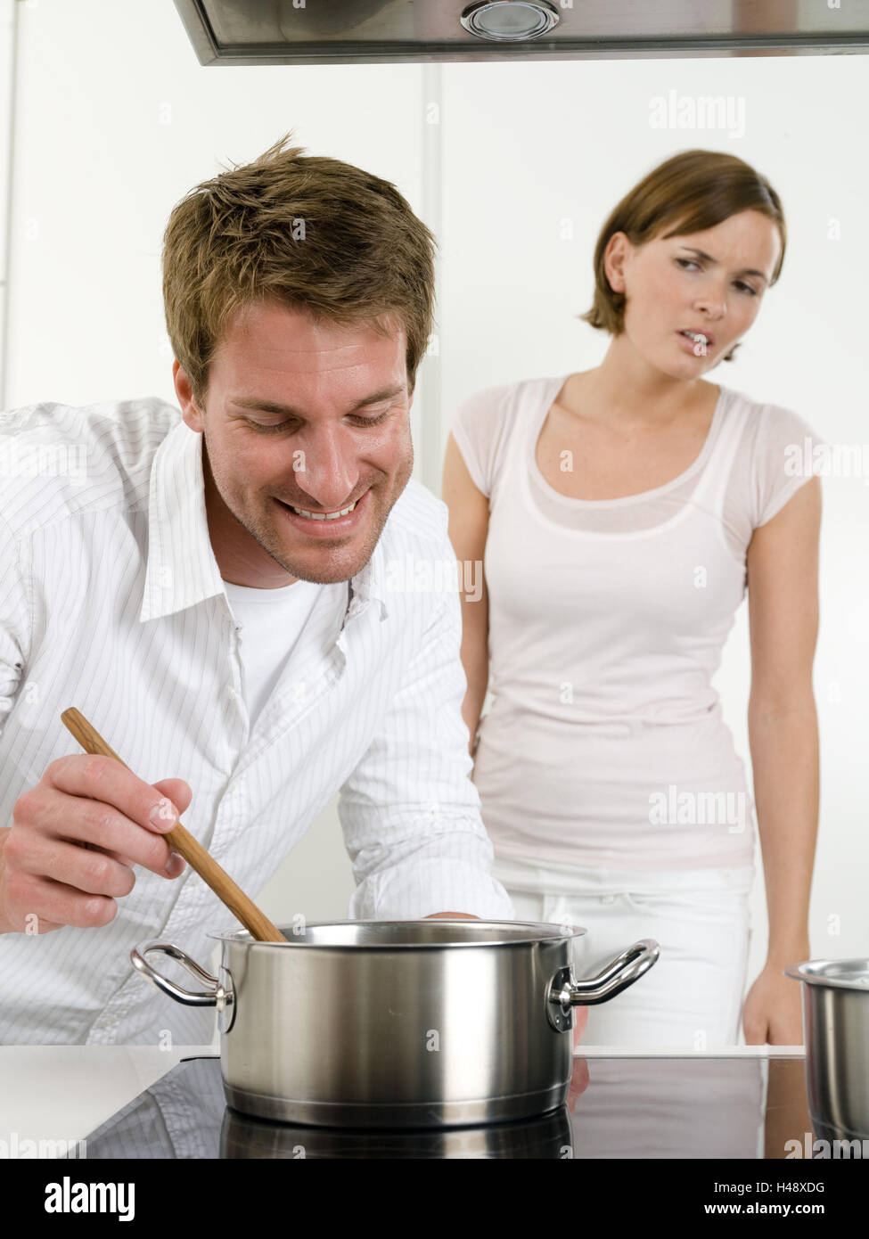 Couple, young, cooking, cuisine, saucepan, doubtfully Stock Photo
