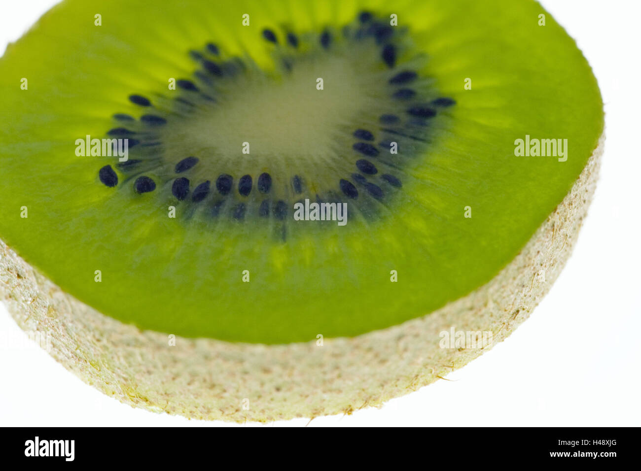 Kiwi, detail, cut open, slice, transmitted light, green, detail, Food, fruit, berries, kiwi fruits, fruits, ovally, flesh, green, fruit axis, cores, ripe, sweetly, sour, juicy, fruity, pale green, vitamins, freshness, curled, medium close-up, product photography, studio, Stock Photo