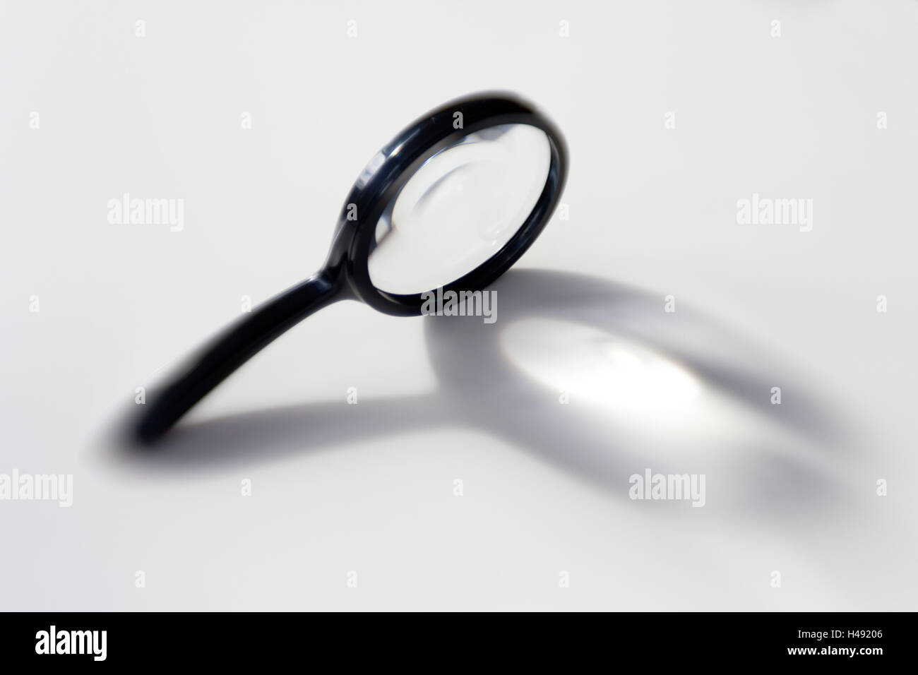 Loupe as an icon for examination, checking Stock Photo - Alamy