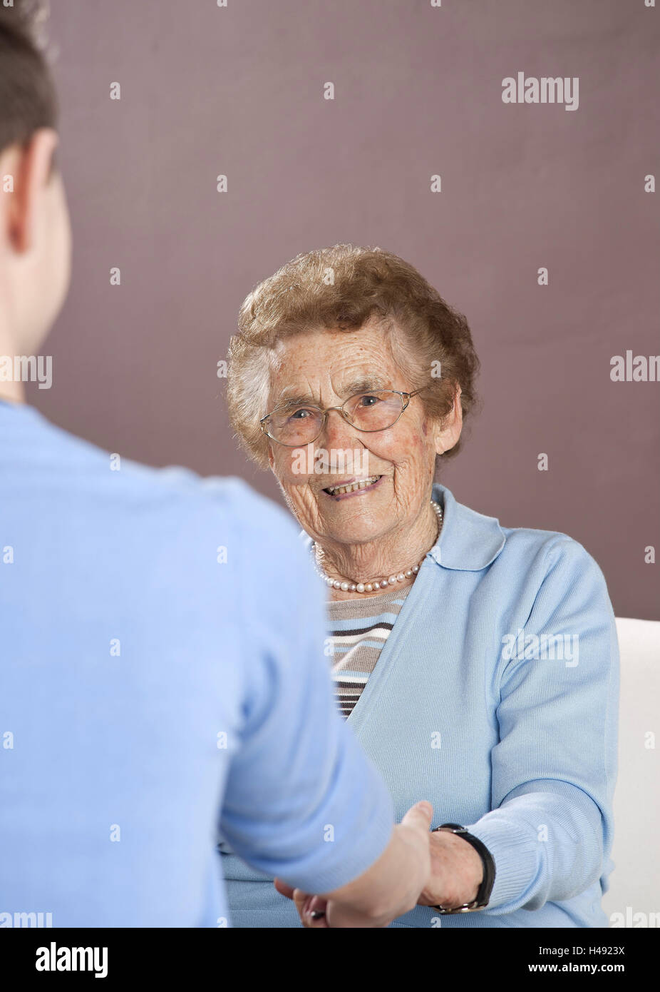 Grandson holds to his grandmother the hands, Stock Photo