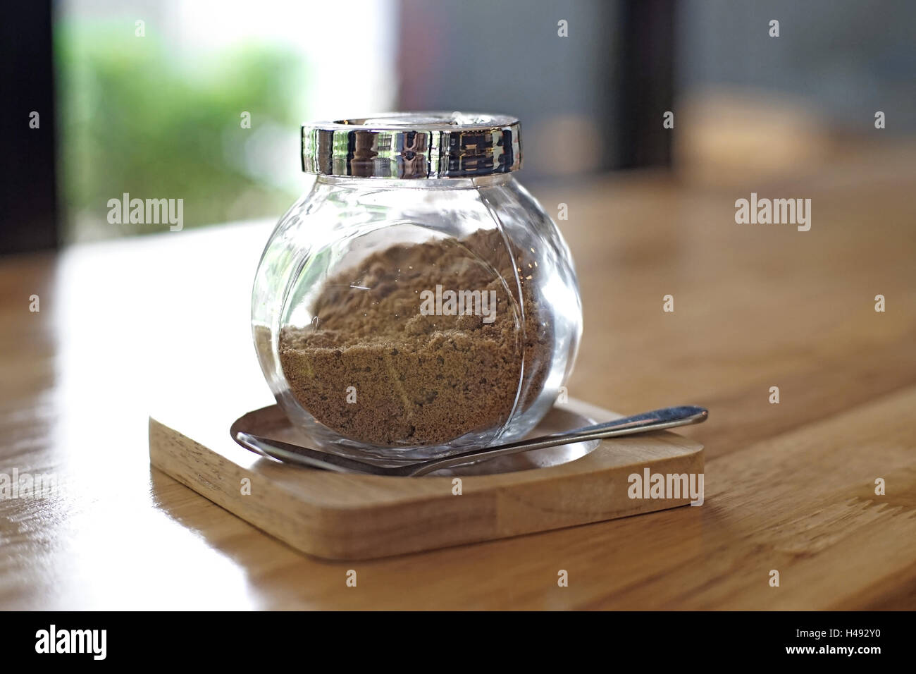 jar of brown sugar and spoon on wooden table Stock Photo Alamy