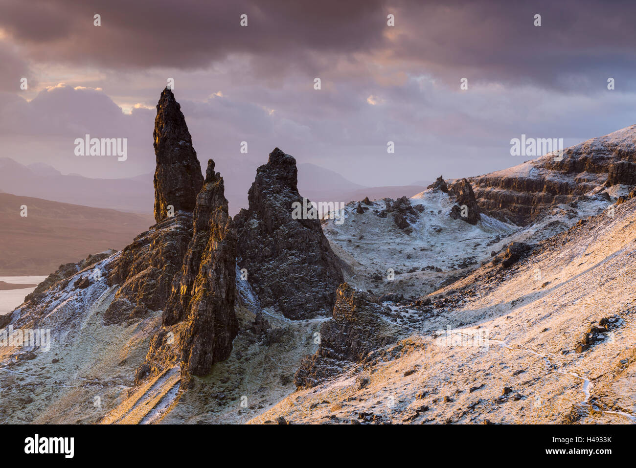 Snow dusted Old Man of Storr at sunrise, Isle of Skye, Scotland. Winter (December) 2014. Stock Photo
