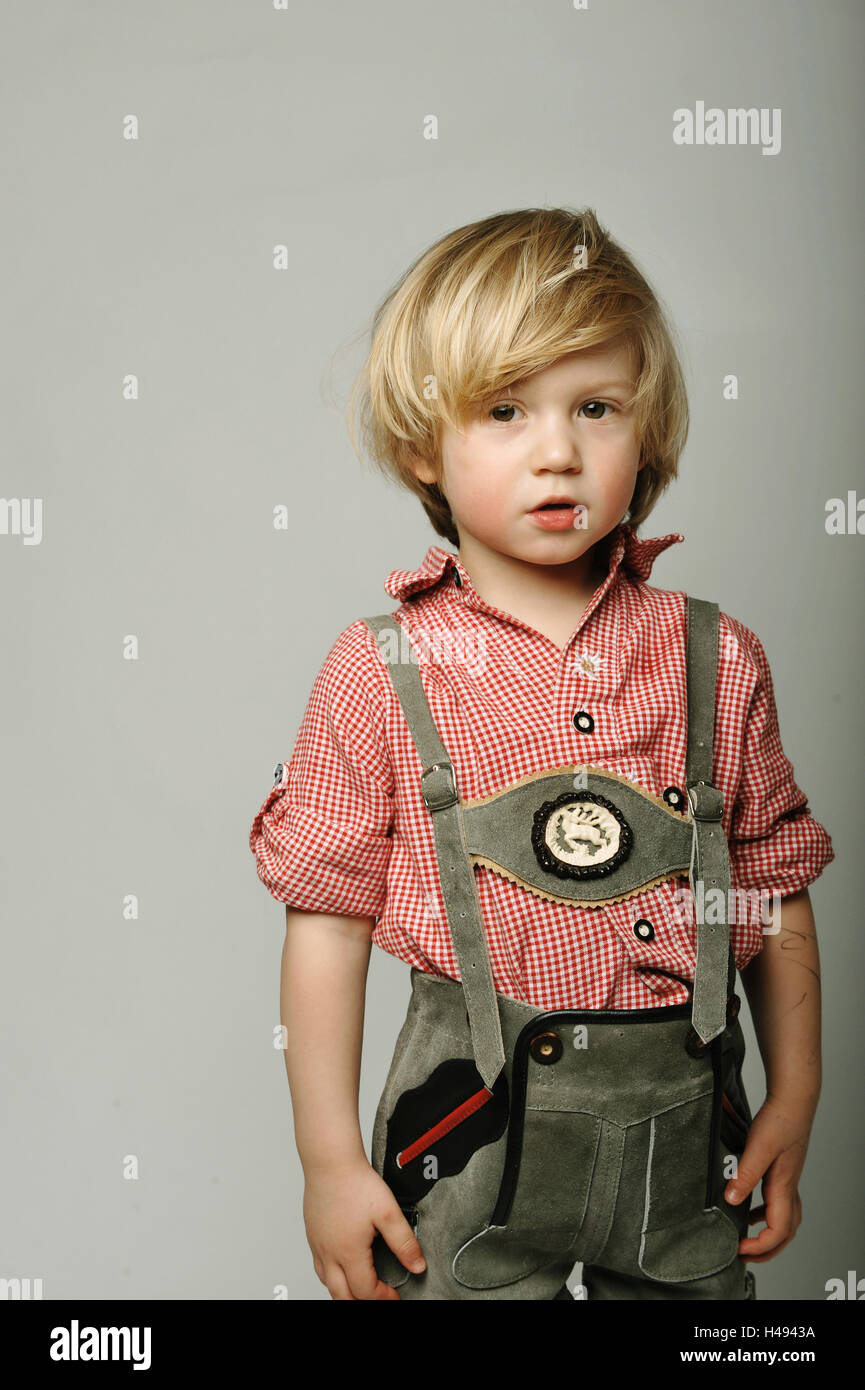 Boy, 3 years old, traditional shirt, leather trousers, seriously,  self-confidently, view camera, half portrait, child, blond, traditional  shirt, clothes, bavarian, Austrian, braces, shirt, checked, red-white,  thoughtfully, cool, carelessly, childhood ...