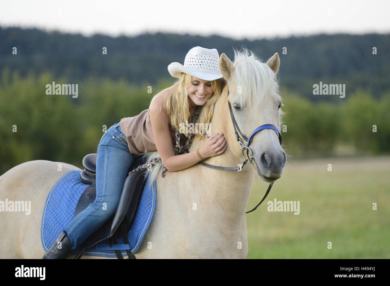 young woman, horse, Iceland horse, back, lying, Stock Photo
