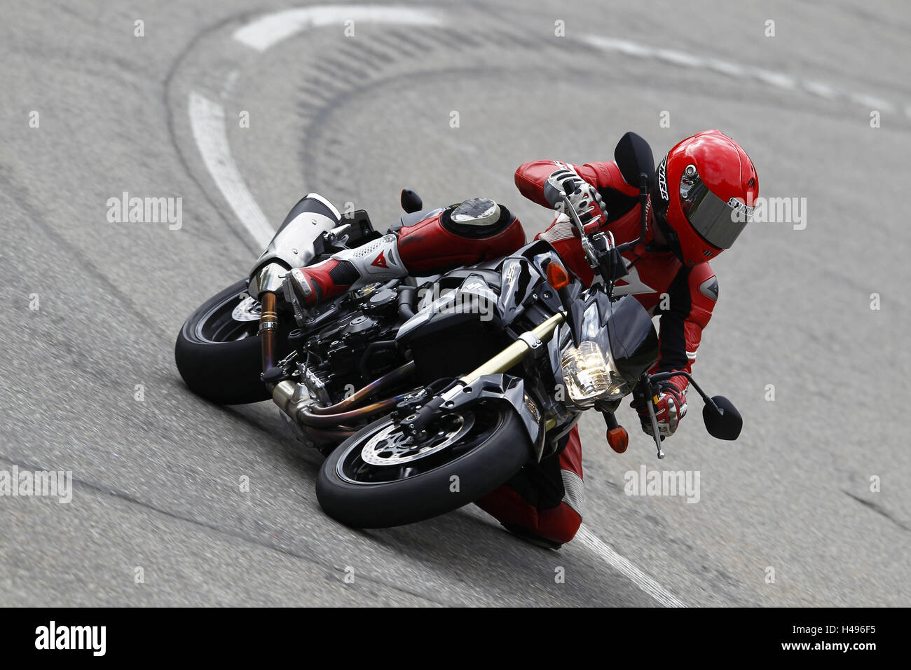 Motorcyclist in bend, Suzuki GSR, dynamically, Stock Photo