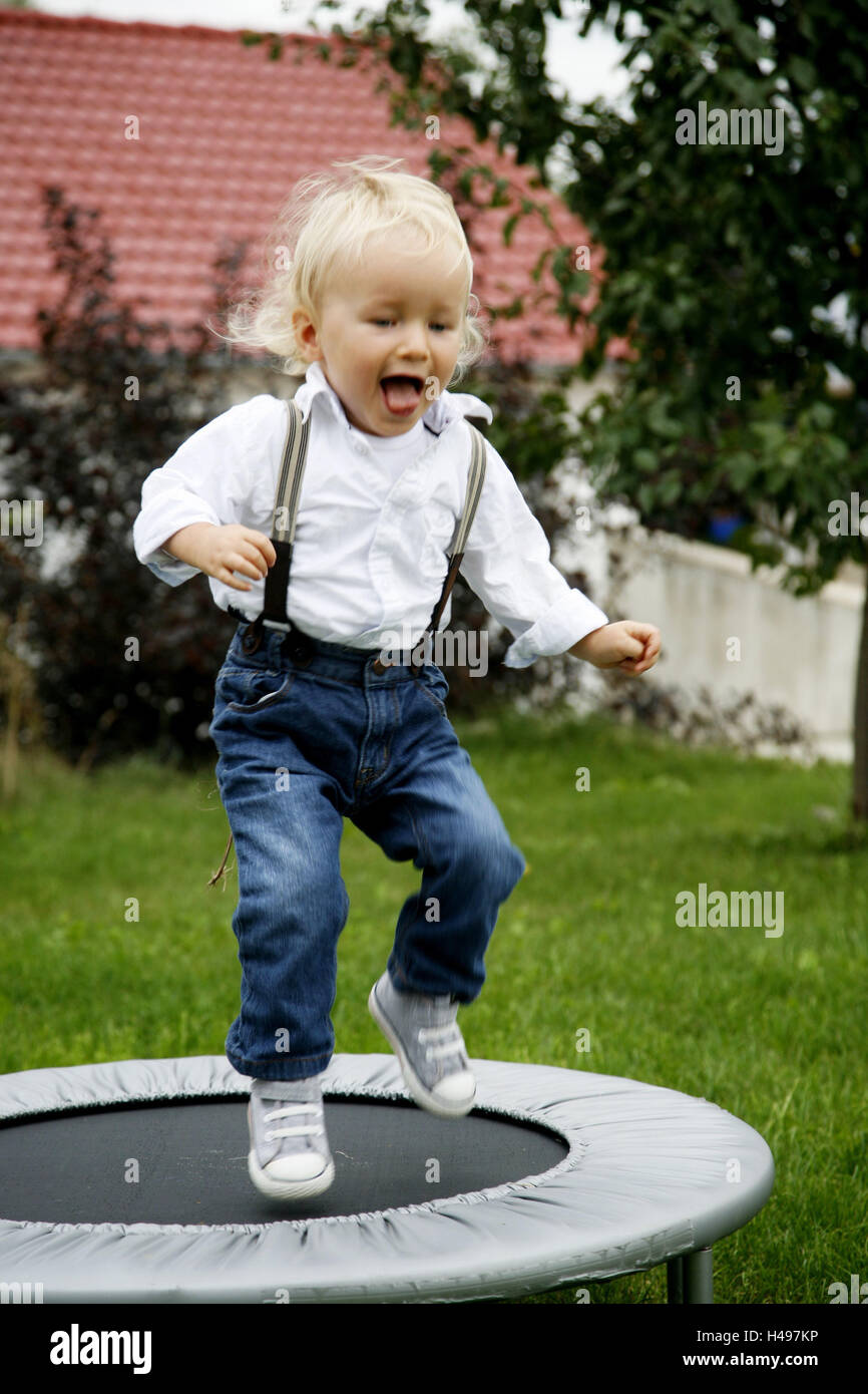Infant, boy, tram Pole, hop, play fun, blond, child, person, shirt, braces, happy, very fair, sweetly, joy, whoop with joy, sport, motion, mini tram Pole, Stock Photo