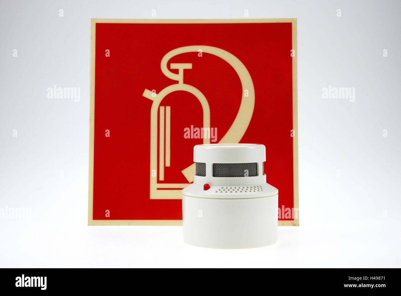 Smoke detector, fire extinguisher, tip notice board Stock Photo Alamy