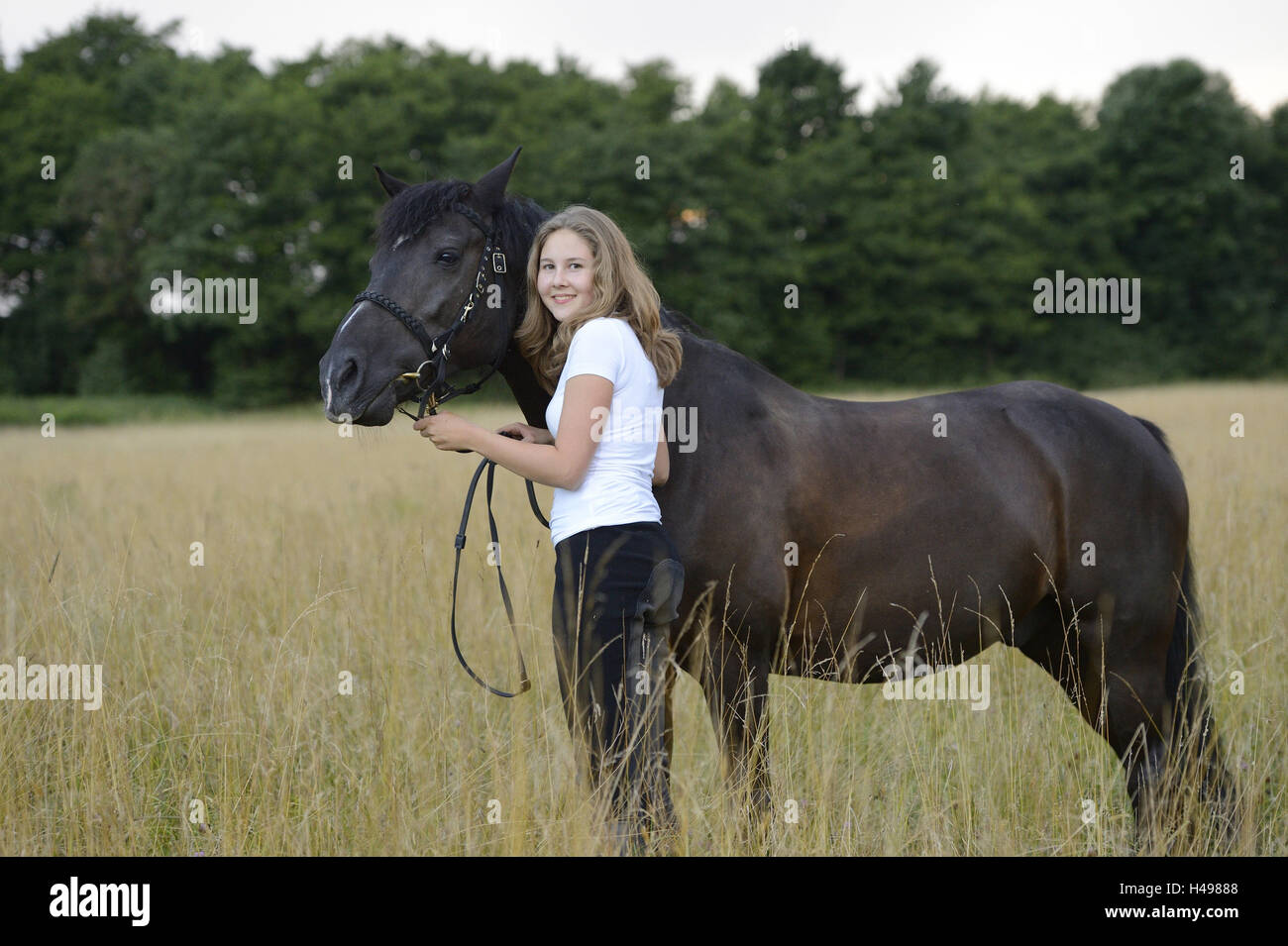 Girls, horse, meadow, stand, view camera, scenery, Stock Photo