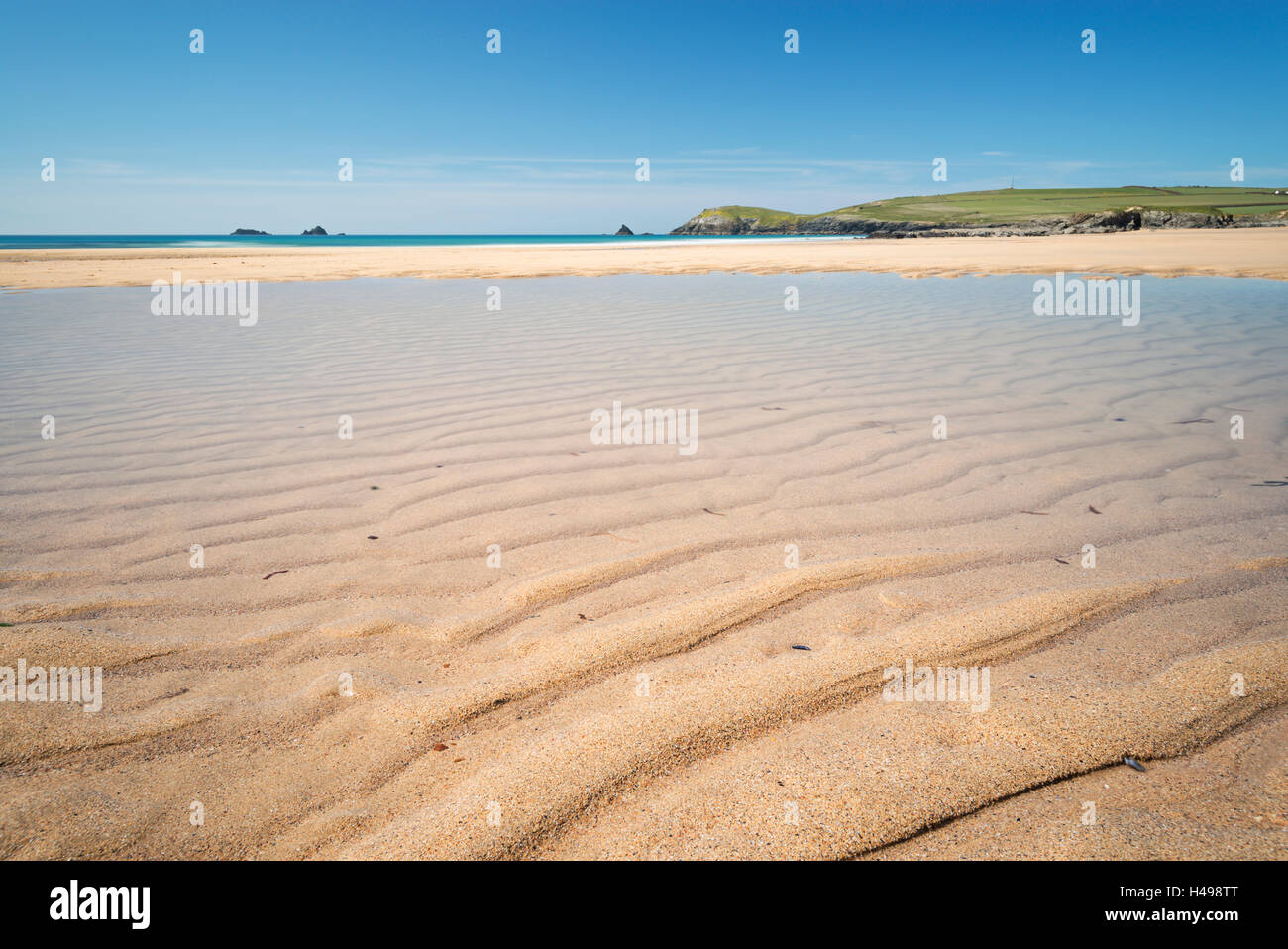 Sandy lagoon on Constantine Beach at low tide, Cornwall, England. Stock Photo