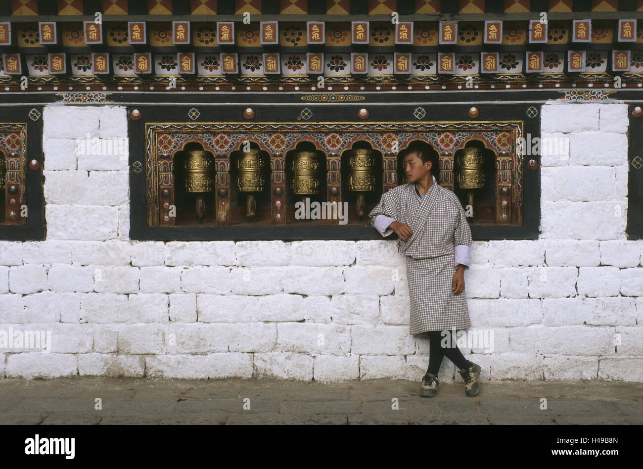 Bhutan, Thimphu, cloister fortress Dzong, man, prayer mills, Asia, the Himalayas, kingdom, Westbhutan, capital, seat of government, cloister, cloister facility, cloister castle, fortress, structure, building, historically, culture, Gho, Buddhist, religion Stock Photo
