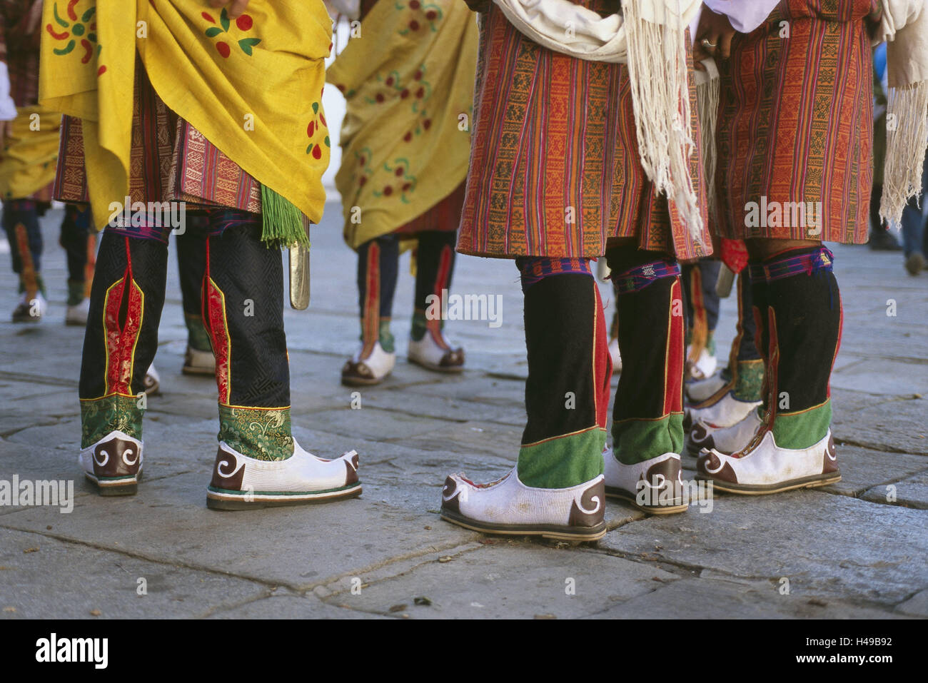 Bhutan, Thimphu, men, national costume, Kho, detail, bones, Asia, the Himalayas, kingdom, Westbhutan, capital, culture, person, Bhutanese, Buddhist, group, stand, tradition, man's clothes, man's national costume, Gho, holiday national costume, fixed national costume, fixed clothes, clothes, holiday clothes, boot, brightly, colorfully, colours, outside, Stock Photo