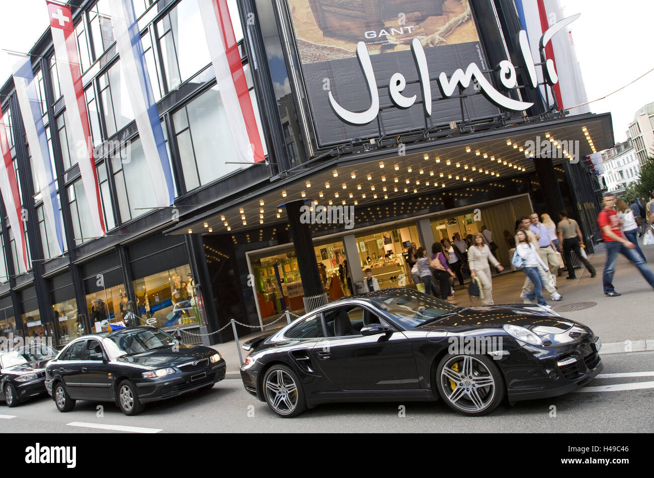 Switzerland, Zurich, department store of 'Jelmoli', passer-by, cars, no model release, no property release, tourism, shop shopping, loading, business, traffic, person, Porsche, luxury, consumption, street scene, outside, building, architecture, Stock Photo
