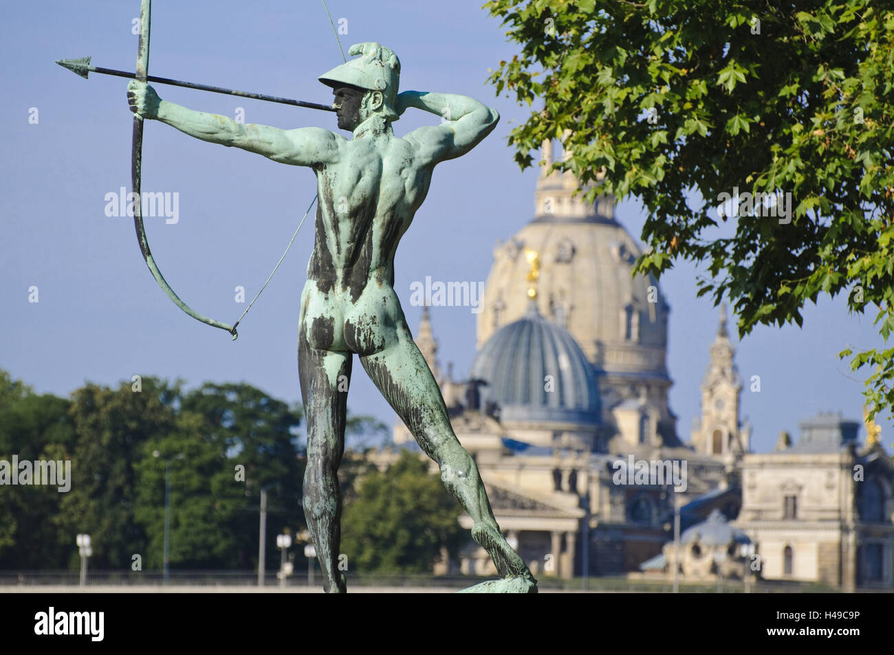 Bronze figure archer from 1902 by Ernst Moritz Geyger, Church of Our Lady in the background, Neustadt, Dresden, Saxony, Germany, Stock Photo