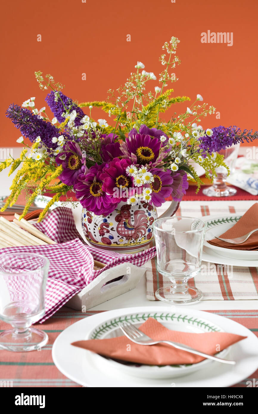 Autumn bouquet in the jug on covered table, Stock Photo