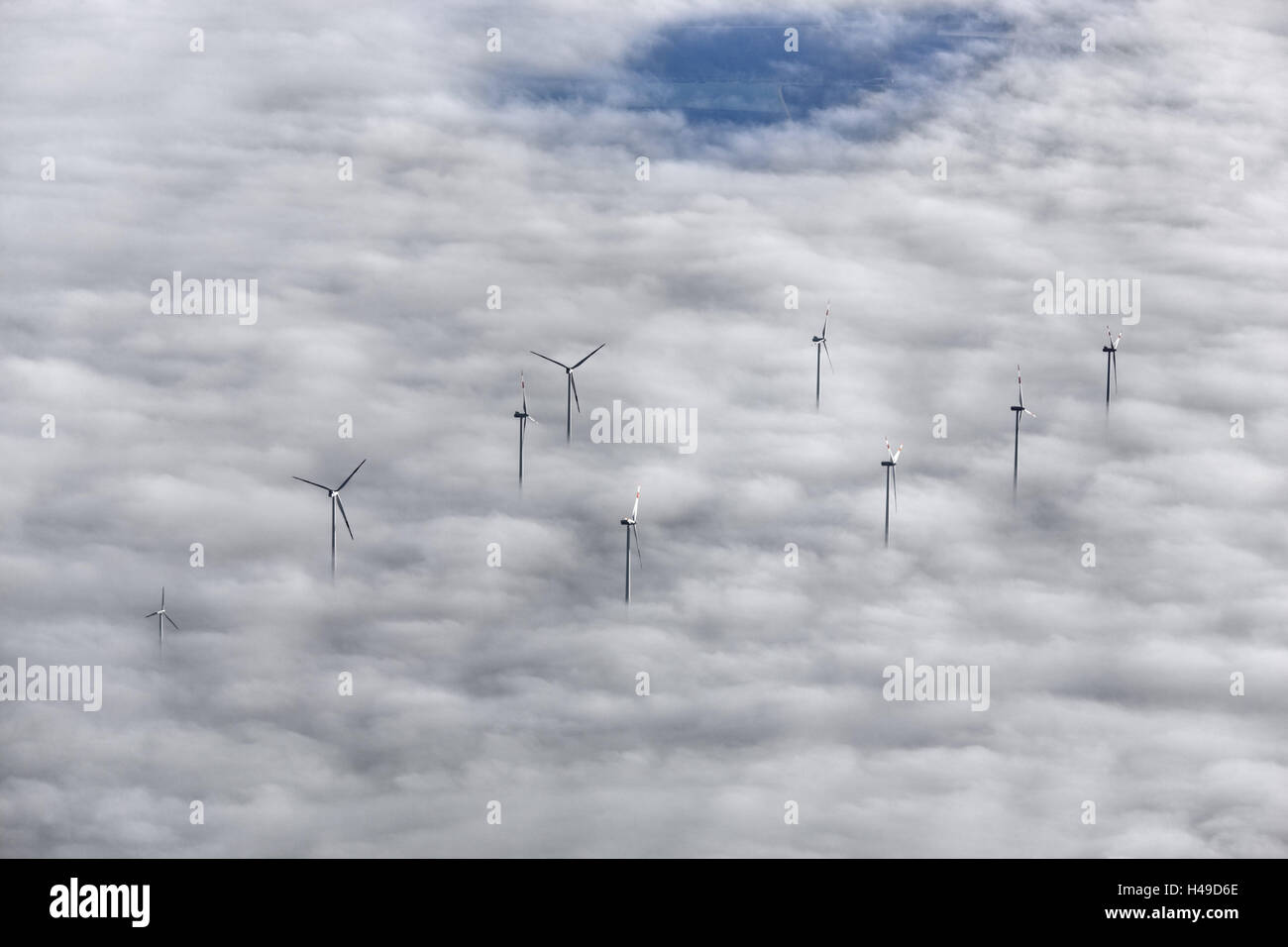 Wind turbines, ground fog, aerial shot, Stock Photo