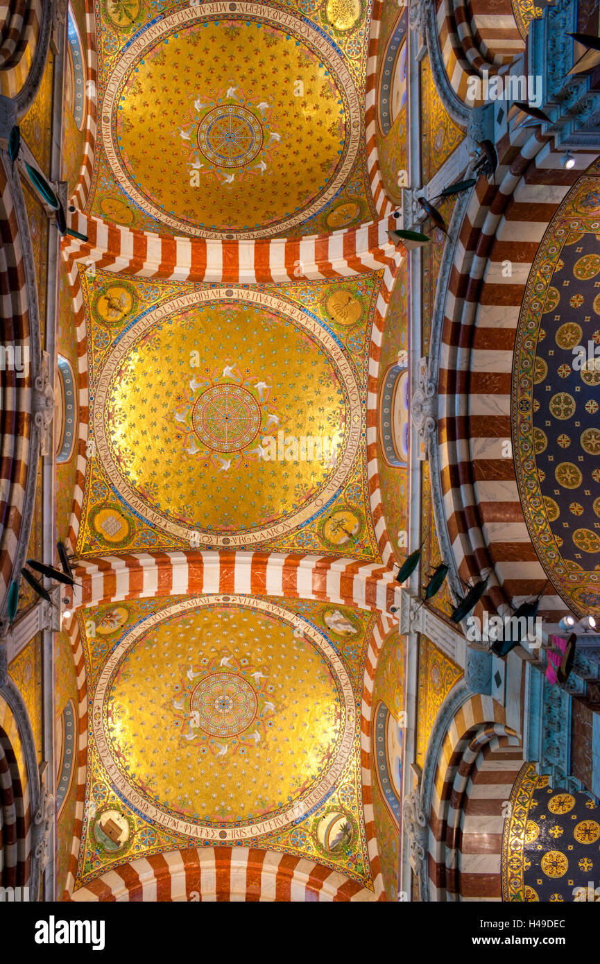 The ceiling of the Basilica of Notre-Dame is topped by three cupolas decorated with identical mosaics, Marseille France Stock Photo