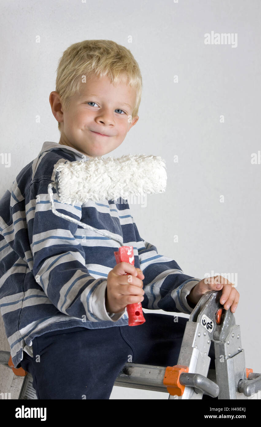 Boy, happy, conductors, colour scooters, point, child, person, half portrait, blond, sit, smile, hold, present, folding conductors, men at work, painter's role, inker, to painters, glide, wall, renovate, renovation, coat paint, do it yourself, do-it-yourselfer, Th it yourself, resolutely, proudly, selbsbewusst, help, craftsman, cut out, inside, Stock Photo