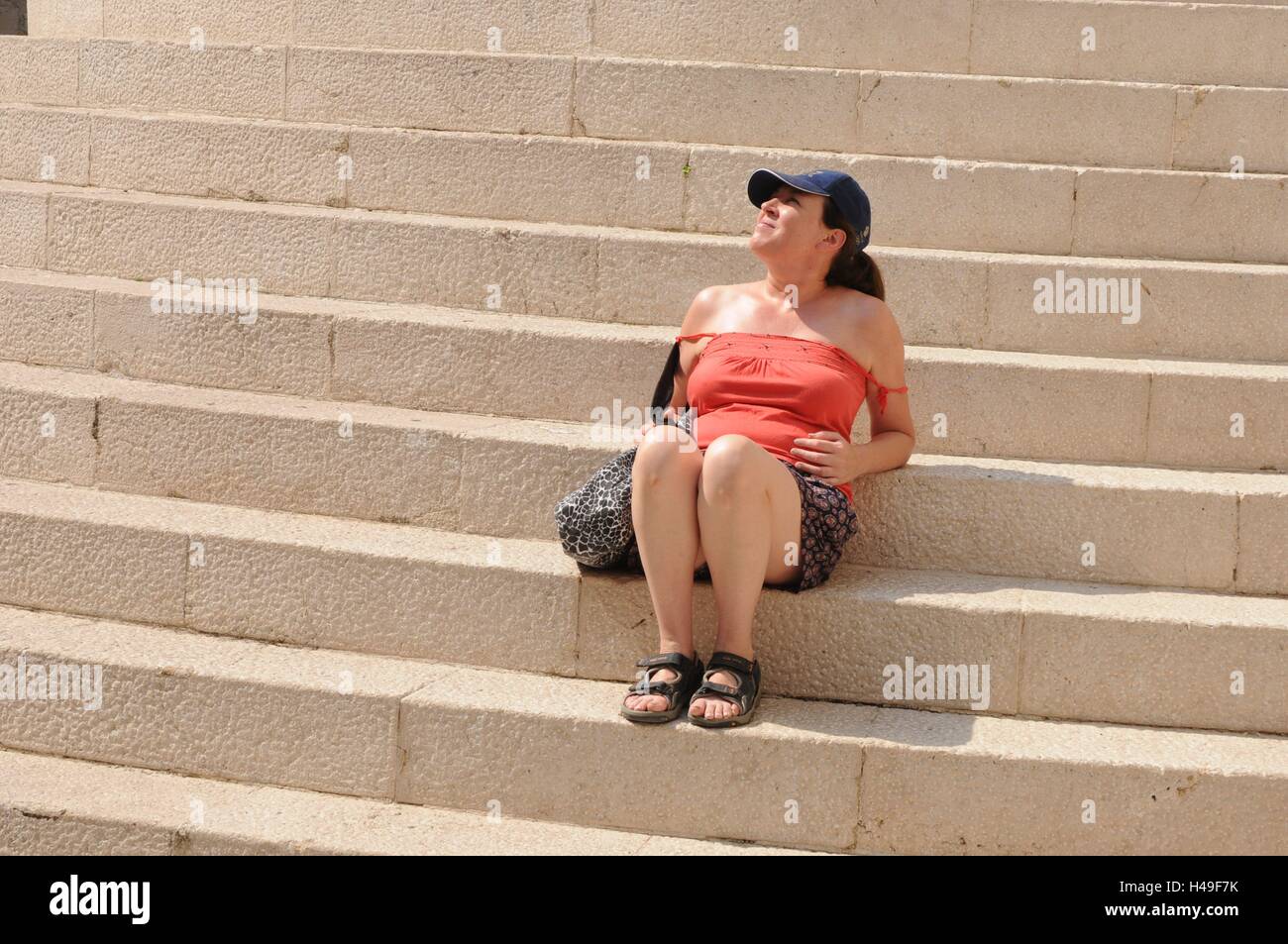 A woman relaxing after walking around the Old Town of Dubrovnik, Croatia. Stock Photo