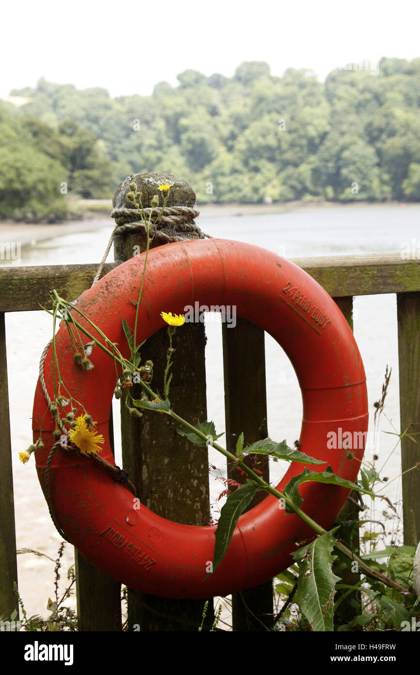 Riverside, wooden fence, lifebelt, red, river, shore, fence, wooden pole,  life preserver, help, rescue, concept, drowning, danger, misery, emergency,  mortal danger, difficulty, lifesaving, swimming aid, bathing accident Stock  Photo - Alamy
