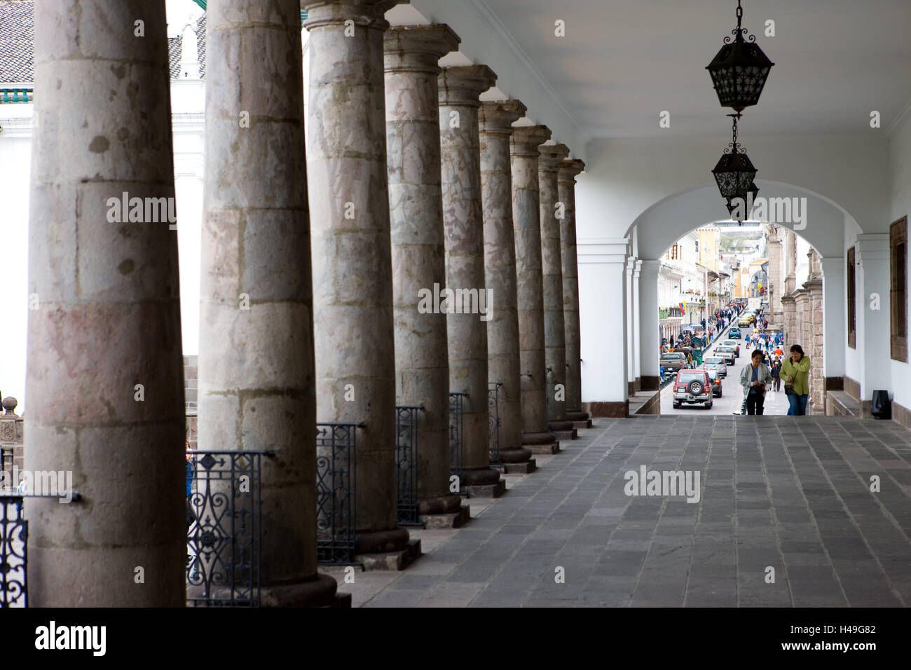 Ecuador, province Pichincha, Quito, presidential palace, detail, colonnade, passer-by, South America, town, capital, architecture, building, structure, outside, pillars, passage, street, person, pedestrian, passer-by, place of interest, Stock Photo