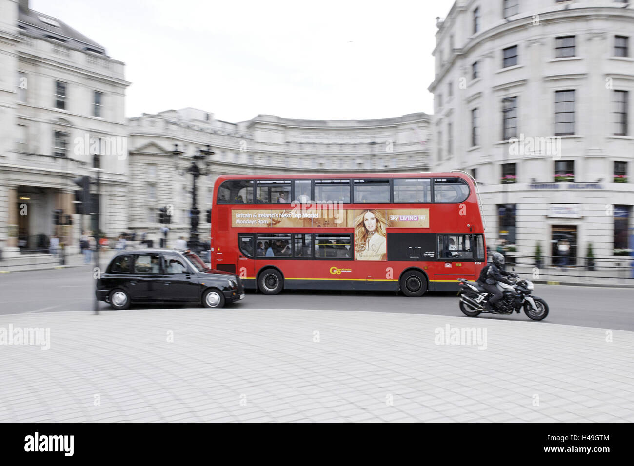 Street scene, red double-decker bus, roundabout, Charing Cross, Trafalgar Square, City of Westminster, London, England, UK, Stock Photo