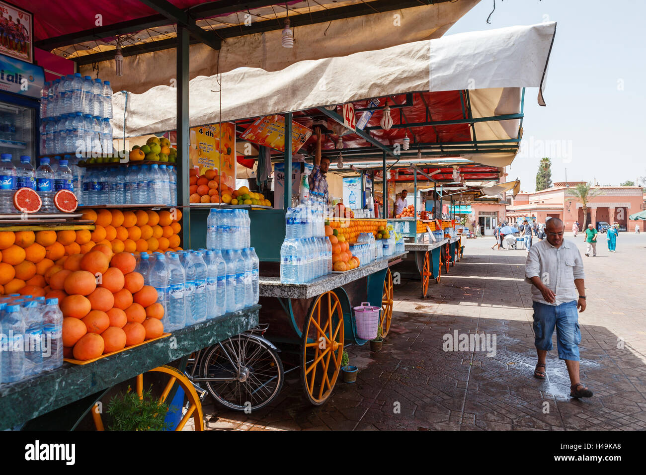 Orange juice sellers on Jamaa el Fna market, Marrakesh, Morocco Stock Photo