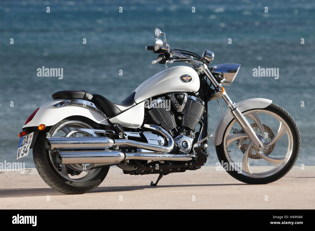 Motorcycle, Cruiser, Victory, white metallic, sea in the background, diagonal, Stock Photo