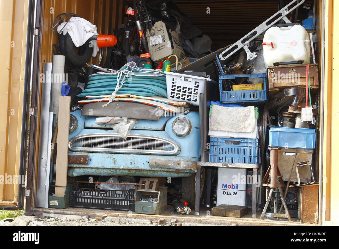Garage, Lloyd Oldtimer, barn finding under scrap metal Stock Photo - Alamy