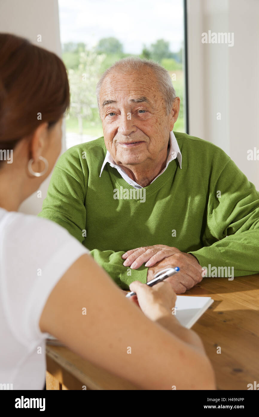 Senior looking on patient's provision, Stock Photo