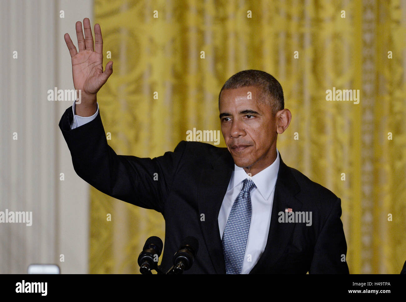 United States President Barack Obama waves after speaking at a reception for Hispanic Heritage Month in the East Room of the White House on October 12, 2016 in Washington, DC. Credit: Olivier Douliery/Pool via CNP /MediaPunch Stock Photo