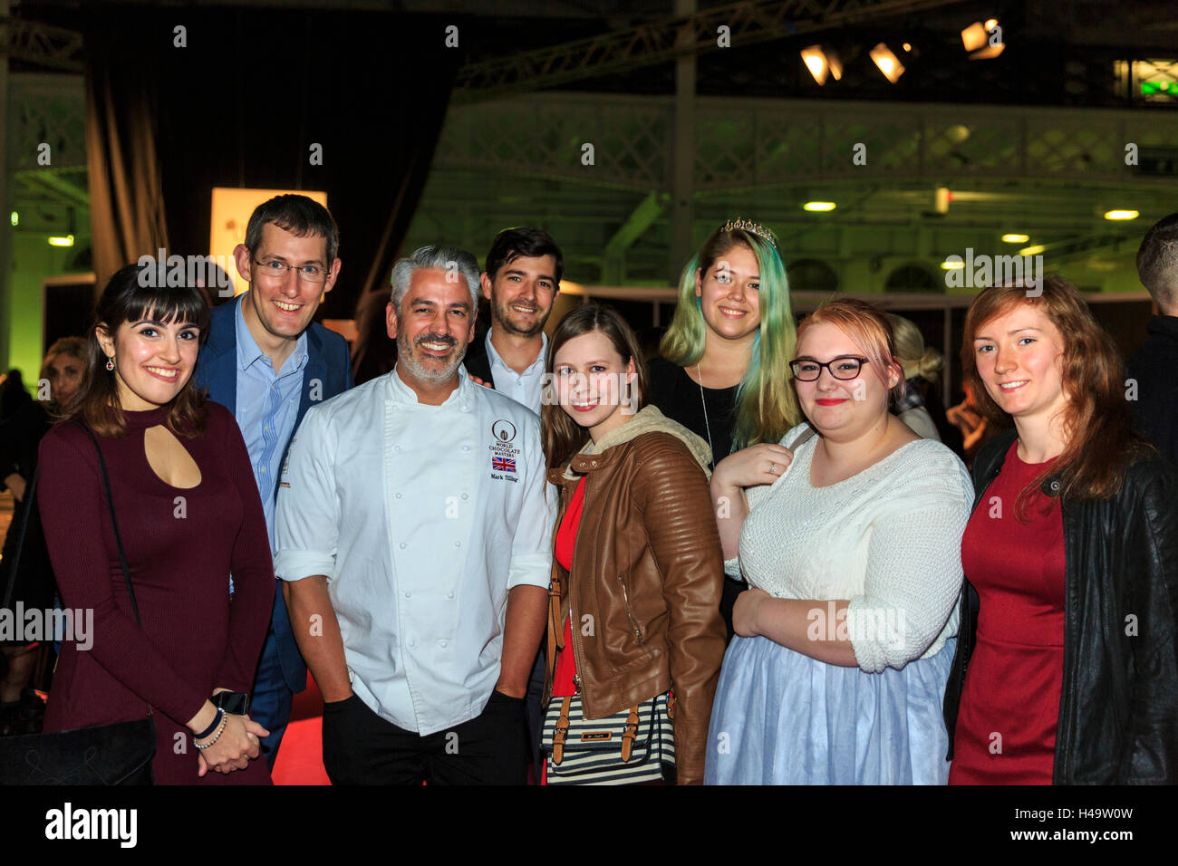 Kensington Olympia, London, 13th October 2016. Mark Tilling, the UK Chocolate Master who won the Bake Off Crème de la Crème, with students and staff from the Southbank University National Bakery School. The Chocolate show, the grand finale of Chocolate Week, opens at London's Olympia with a VIP gala evening and chocolate fashion show, before welcoming visitors from 14th-16th October. Credit:  Imageplotter News and Sports/Alamy Live News Stock Photo