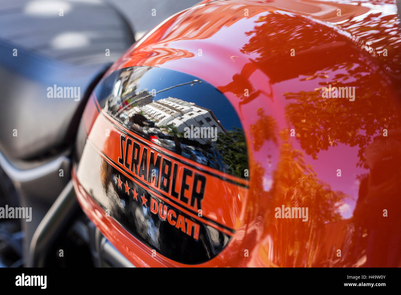 Close up of reflection in tank of a Ducati scrambler motorbike Stock Photo